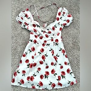 This is a floral summer dress brand new size Medium but fits like a small